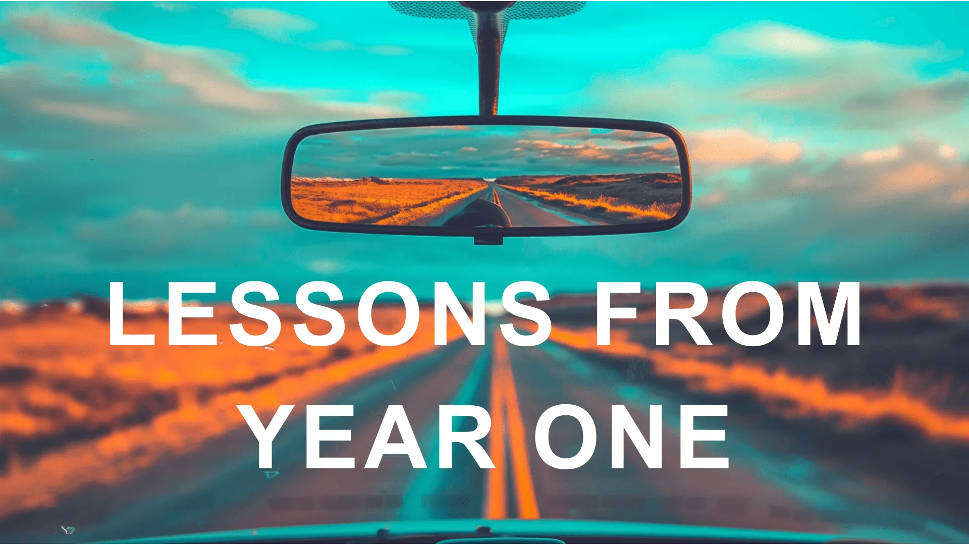 A rearview mirror with text superimposed that says lessons from year one